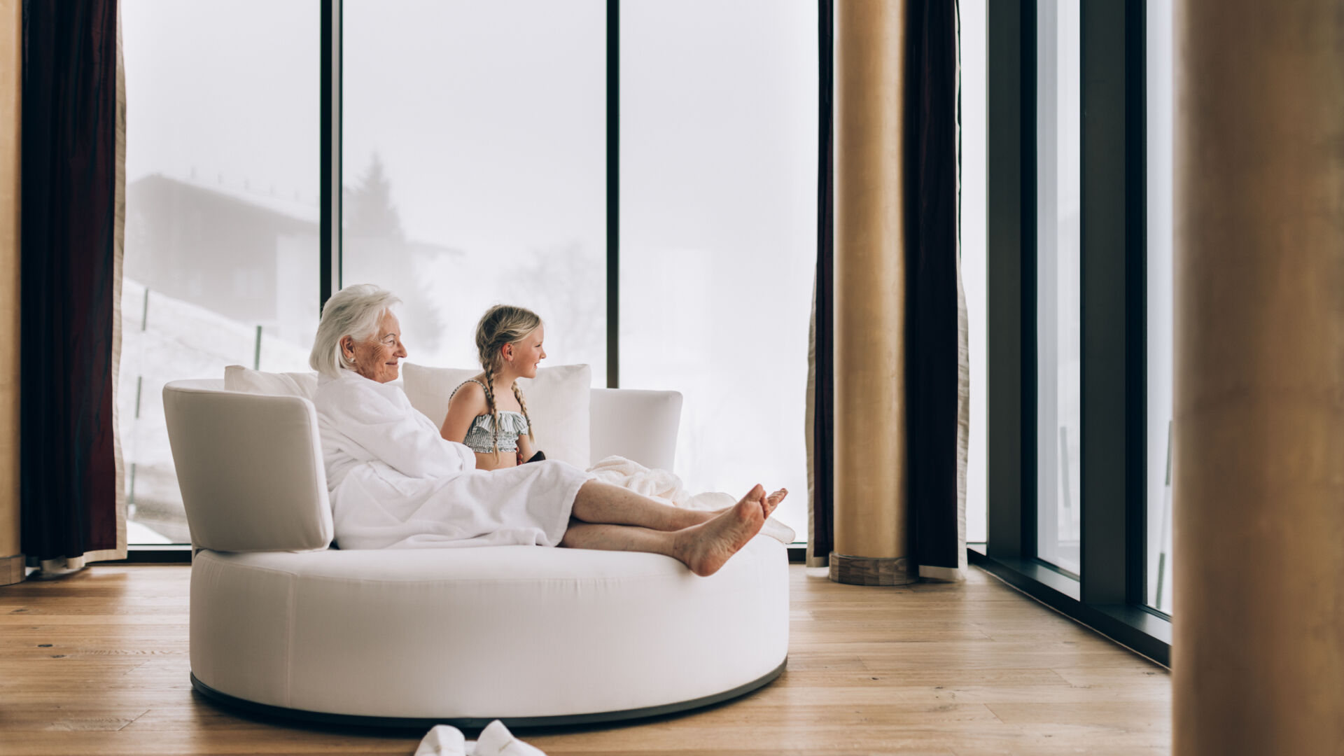 Grandma and grandchild relaxing in the spa area