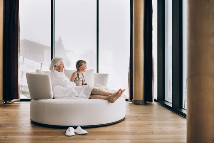 Grandma and grandchild relaxing in the spa area